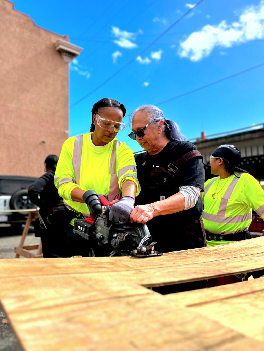 A Women Building the Bay student practices with a power saw at Rising Sun's Oakland headquarters